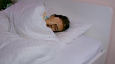 The tooth fairy brought money under the pillow to the child. selective focus. Kid.