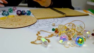 Woman numerologist astrologer counts numbers. Selective focus. People.