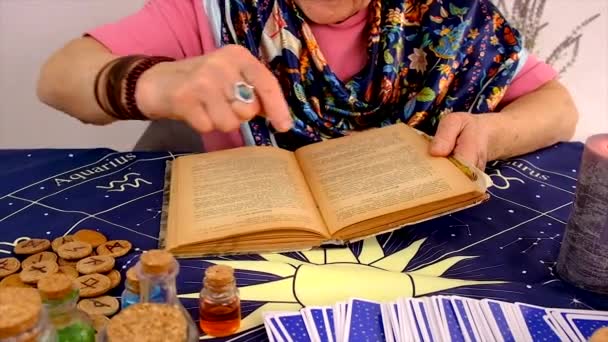 Woman Fortune Teller Reads Book Spells Selective Focus People — Stockvideo