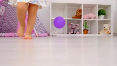The child is playing with a balloon. Selective focus. Kid.