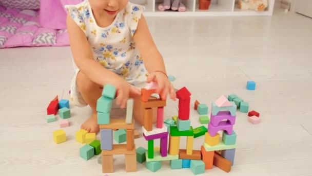 Child Plays Childrens Room Wooden Constructor Selective Focus Kid — Vídeo de stock