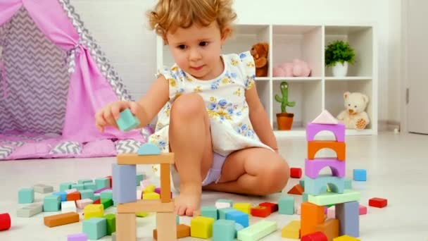 Child Plays Childrens Room Wooden Constructor Selective Focus Kid — ストック動画