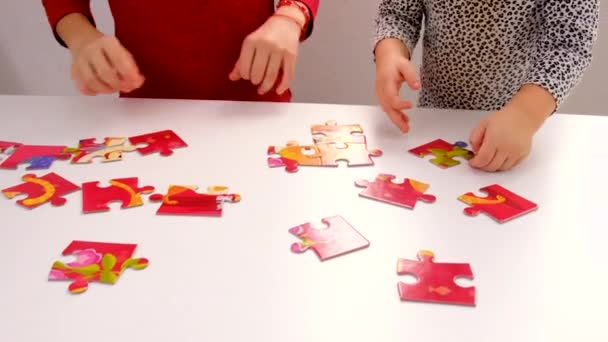 Child Puts Together Puzzle Selective Focus Kid — стоковое видео