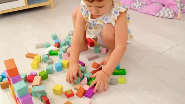 Child Plays Childrens Room Wooden Constructor Selective Focus Kid — Vídeo de stock
