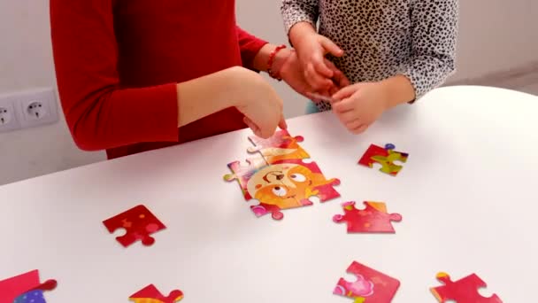 Child Puts Together Puzzle Selective Focus Kid — Stockvideo