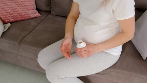 Pregnant Woman Drinks Omega Three Selective Focus White — Stock Video