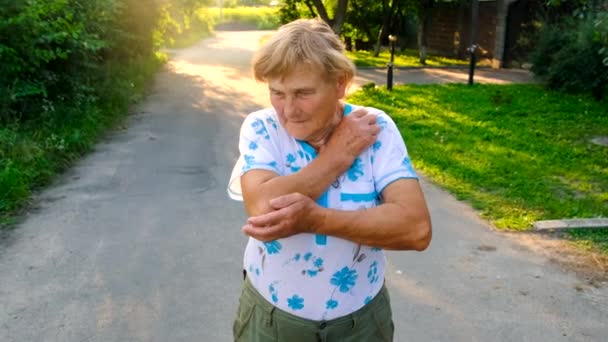 Old Woman Has Sore Elbow Selective Focus Hand — Stock Video