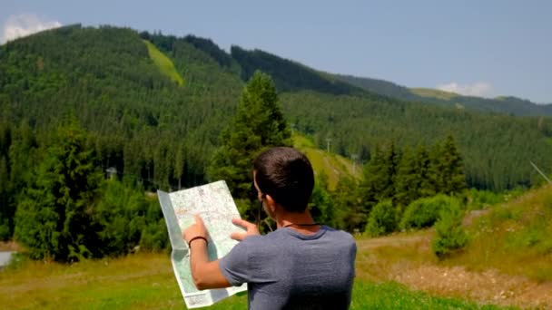 Man Looks Map Backdrop Mountains Selective Focus People — Stock Video