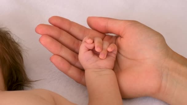 Mom Strokes Babys Hand Selective Focus Kid — Stock Video
