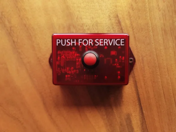 Service call button to press for assistance
