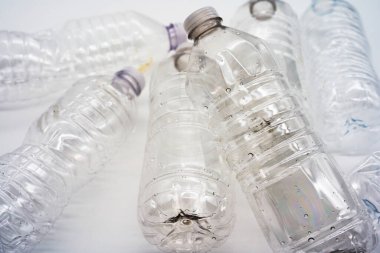 Empty plastic water bottles recycle material reduce waste white background