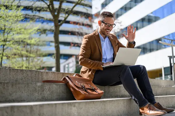 Happy Businessman Waving Hand While Attending Online Meeting Laptop While Ліцензійні Стокові Фото