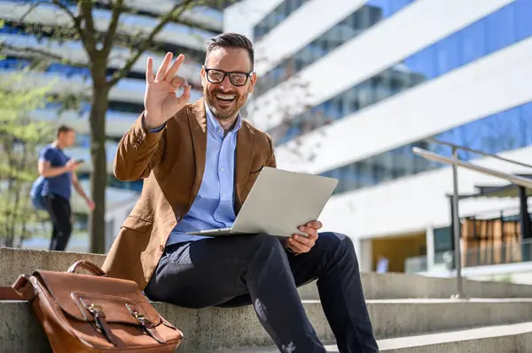 Portrait Positive Male Professional Showing Sign While Working Laptop Steps Ліцензійні Стокові Фото