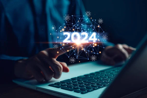 Business growing in 2024. Businessman hand touch virtue screen with laptop. New business startup and goal target. Plans and vision for 2024 year. Data, Opportunity, Challenge and business strategy.