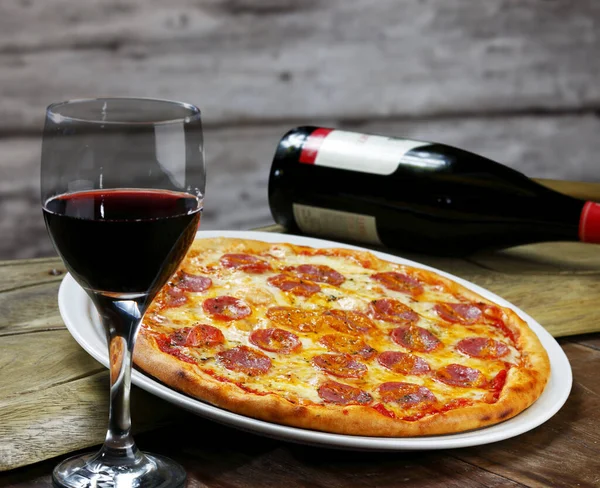 Dinner with wine and pizza