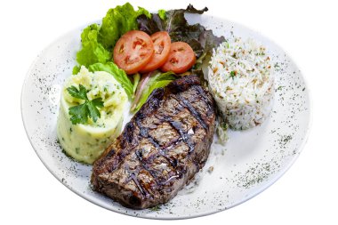 Izgara sığır filetosu, pilav, salata, patates püresi.