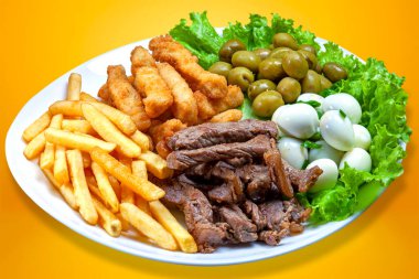 Snacks with fries, meat Picanha, quail egg, olives and breaded fish