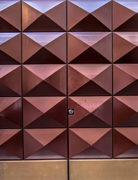 pyramid shaped brown wooden door closeup