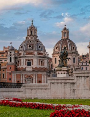golden hour in Rome Italy, view of Santa Maria di Loreto and palazzo Valentini domes from Venice square clipart