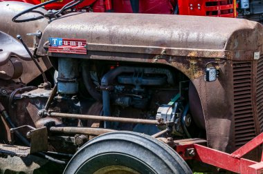 Kinzers, Pennsylvania, August 18, 2022 - View of Steam and Tractor Event with Antique Tractors and one with a Trump 2024 Sign on it on a Sunny Summer Day
