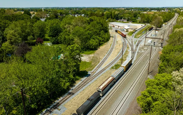 stock image An Aerial View of a Steam Locomotive Moving Freight Cars Around in a Freight Yard to Organize a Freight Train on a Sunny Day