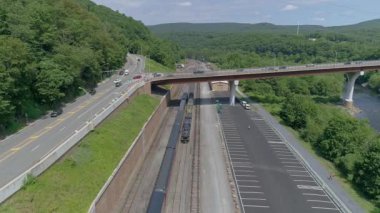 Blue Steam Train and Diesel Exexploring the Scenic Railway and parking Area near the Mountains. Yüksek kalite 4k görüntü