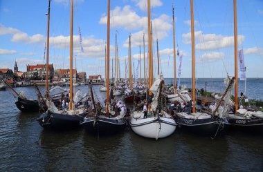 Volendam, The Netherlands - September 12, 2019: Historical sailboats in the historical Volendam fishing harbor participate in a regatta in Volendam, The Netherlands on September 12, 2019