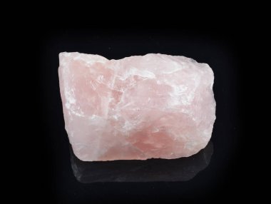 Natural pink quartz on a black background. Macro. Selective focus. clipart