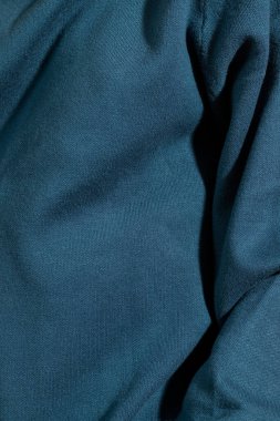 Unrecognizable person in a blue sweater. Extreme close-up.