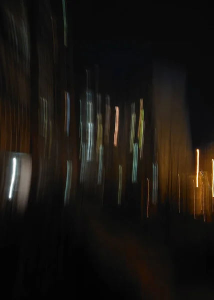 Abstract night photo of residential buildings. Motion blur.