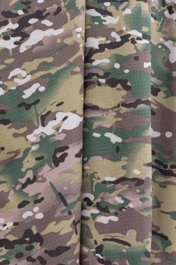 Kamuflaj üniforması deseni. Askeri kumaş dokusu geçmişi.