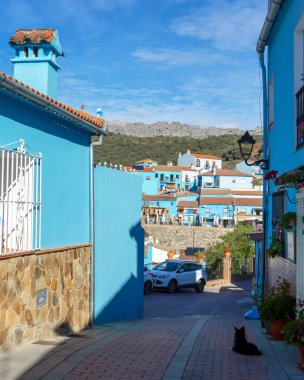 JUZCAR, SPAIN - JANUARY 4 2024: Amaizing morning on blue Smurfs Village in Juzcar, Spain on January 4, 2024 clipart