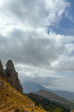 Clouds over mountain in Zafarraya,  Sierra Tejeda Natural Park, Spain clipart