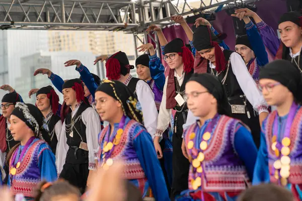 stock image Ankara, Turkey - April 24, 2024: People playing horon (a kind of folkdance) which popular in the black sea region with their local costumes among blurred hands