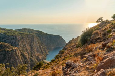 Aerial view of the Butterfly Valley and the Mediterranean sea at sunset, Fethiye, Mugla, Turkey clipart