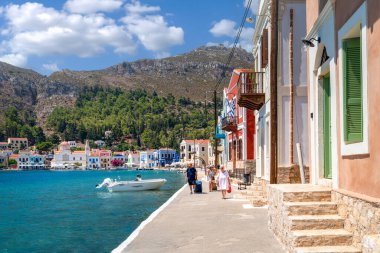 Kastellorizo Island, Dodekanisos, Greece - August 6, 2024: Blue caves tour boat is just in front of the cave clipart