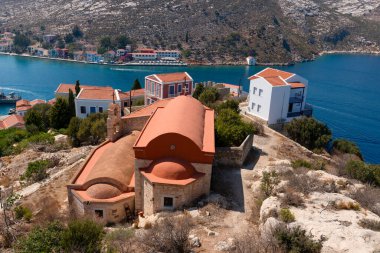 View of the island from the castle on Kastellorizo island  with Church of St Nicholas and St Dimitrios, (Greek orthodox church), Kastellorizo island, Dodekanisos,  Greece clipart