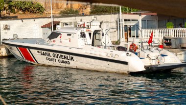 Kas, Antalya, Turkey - August 7, 2024: Turkish Coast Guard ship anchored in Kas harbor. clipart