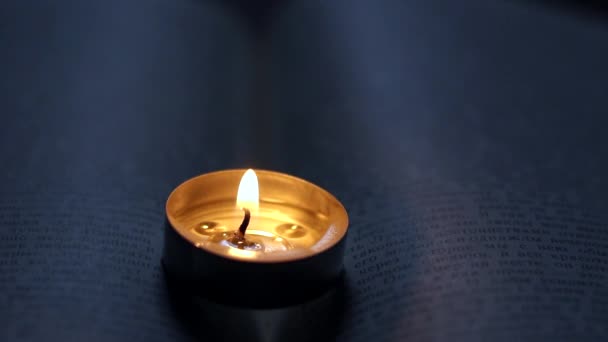 Burning Candle Book Blackout Due War Ukraine — Stock Video