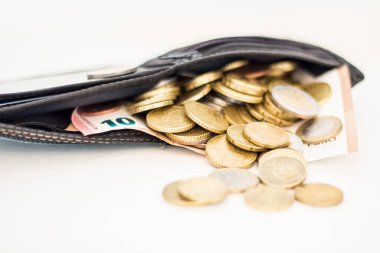 Money scattered around the wallet. Rising prices due to the war in Ukraine