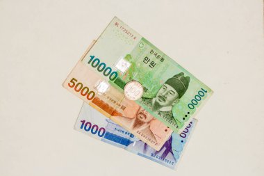 Korean banknotes on a white background.