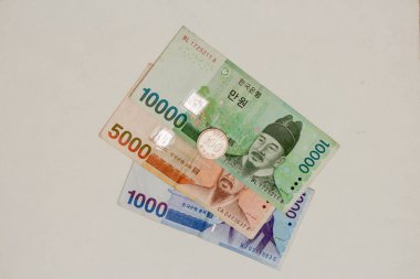 Korean banknotes on a white background.