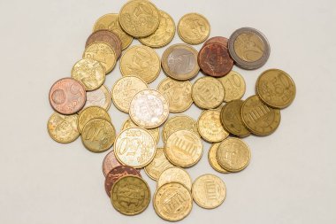 A bunch of euro coins of different denominations.