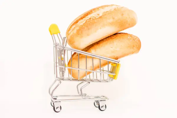 stock image Bread in a toy consumer basket. Rising food prices.