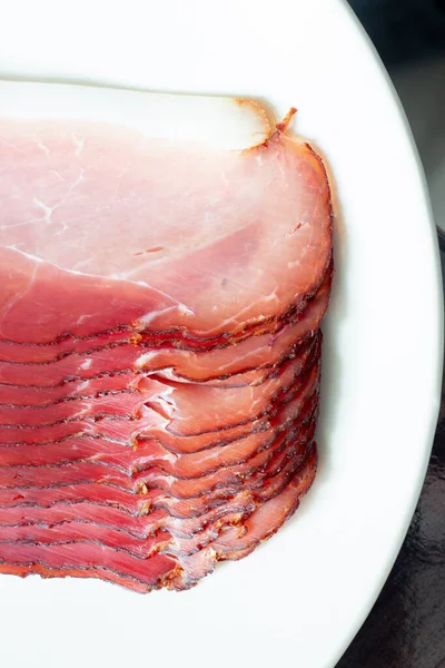 Piecese of raw smoked pork ham.