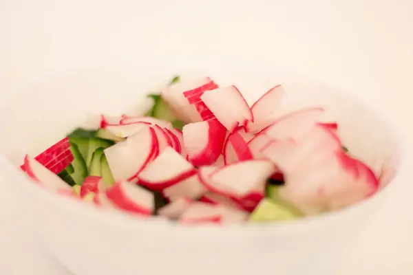 stock image Sliced radish and cucumber for salad.