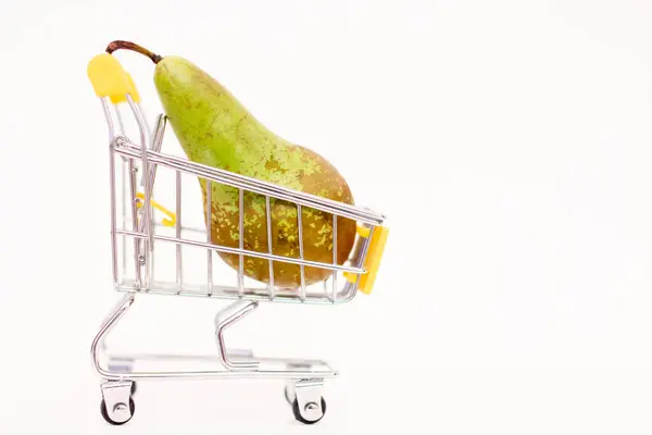 stock image One pear in a shopping cart.