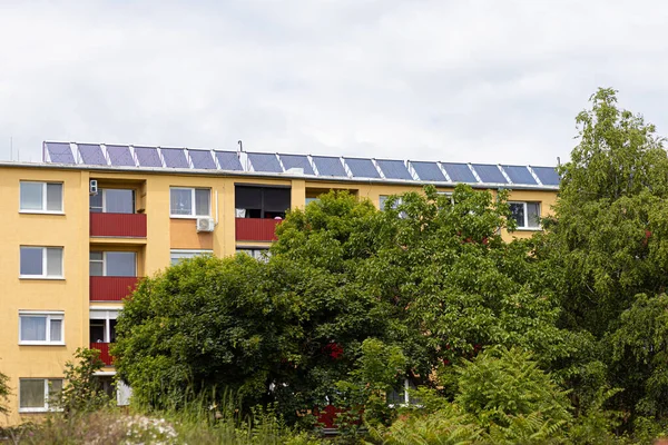 Stock image 11.06.2023 Slovakia. Sala. Solar electric panels on the roof of a residential high-rise building.