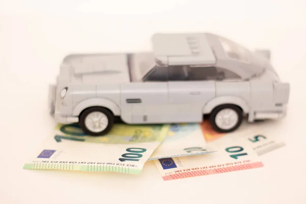 stock image 08.07.2023 Sala. Slovakia. Lego car stands on euro banknotes. Imitation of cars.