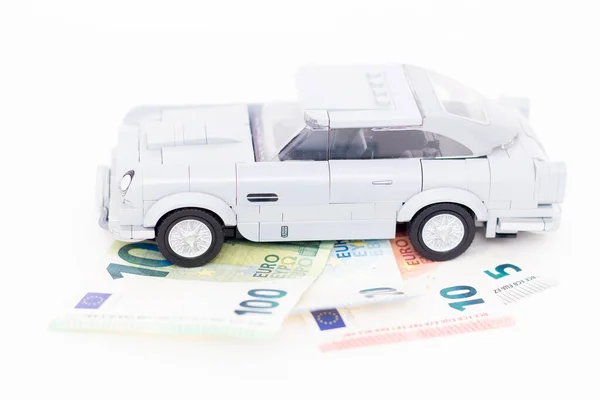 stock image 08.07.2023 Sala. Slovakia. Lego car stands on euro banknotes. Imitation of cars.